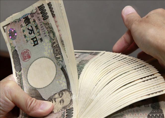  Chú thích ảnh Đồng 10.000 Yên của Nhật Bản. Ảnh: AFP/TTXVN