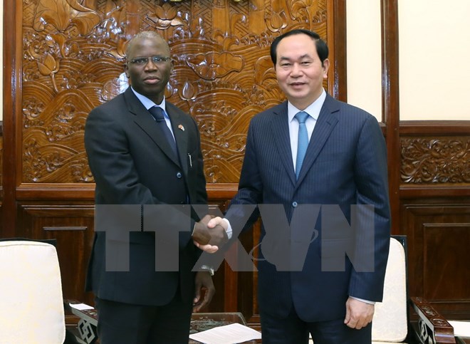 Chủ tịch nước Trần Đại Quang tiếp ông Ousmane Dione, Giám đốc Quốc gia ngân hàng Thế giới (WB) tại Việt Nam. (Ảnh: Nhan Sáng/TTXVN) 