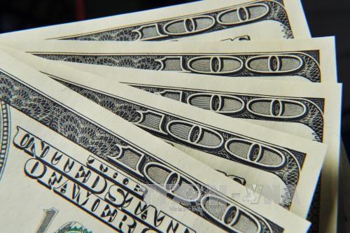 Tiền USD Mỹ mệnh giá 100. Ảnh minh họa: AFP/TTXVN