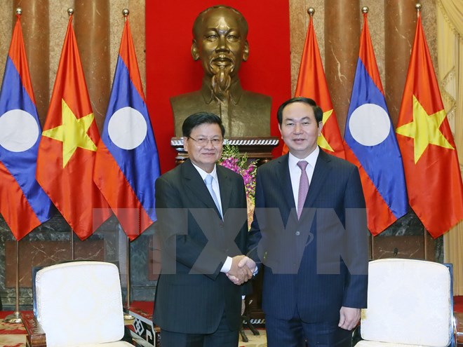 Chủ tịch nước Trần Đại Quang tiếp Thủ tướng Chính phủ Lào Thongloun Sisoulith đang thăm hữu nghị chính thức Việt Nam (Ảnh: Nhan Sáng/TTXVN)