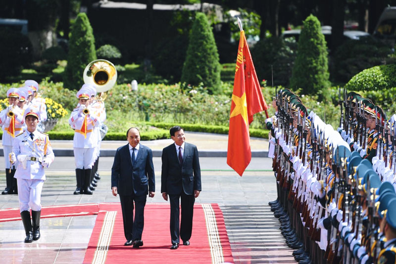 Chủ tịch nước Nguyễn Xuân Phúc chủ trì lễ đón Tổng Bí thư, Chủ tịch nước Lào thăm hữu nghị chính thức Việt Nam hồi cuối tháng 6/2021 (Ảnh: Nhật Bắc)