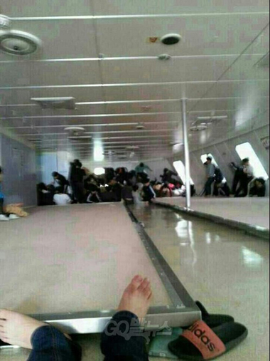 Passengers wait for rescue aboard the Sewol ferry as it sinks in this image posted to a social media site by a student on the ship.