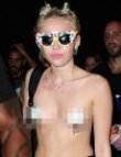 Nữ ca sĩ Miley Cyrus thản nhiên không mặc áo tới hộp đêm